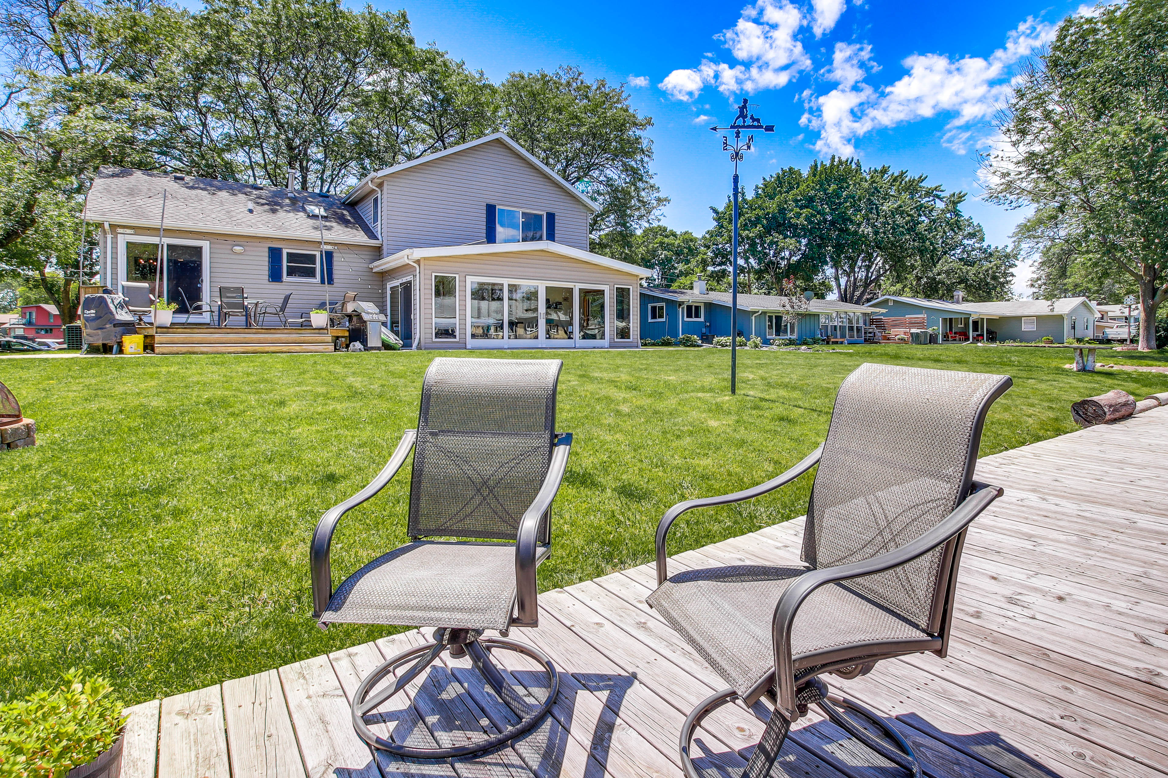 Property Image 1 - Oshkosh Canal-Front Home w/ Sunroom & Watercraft!