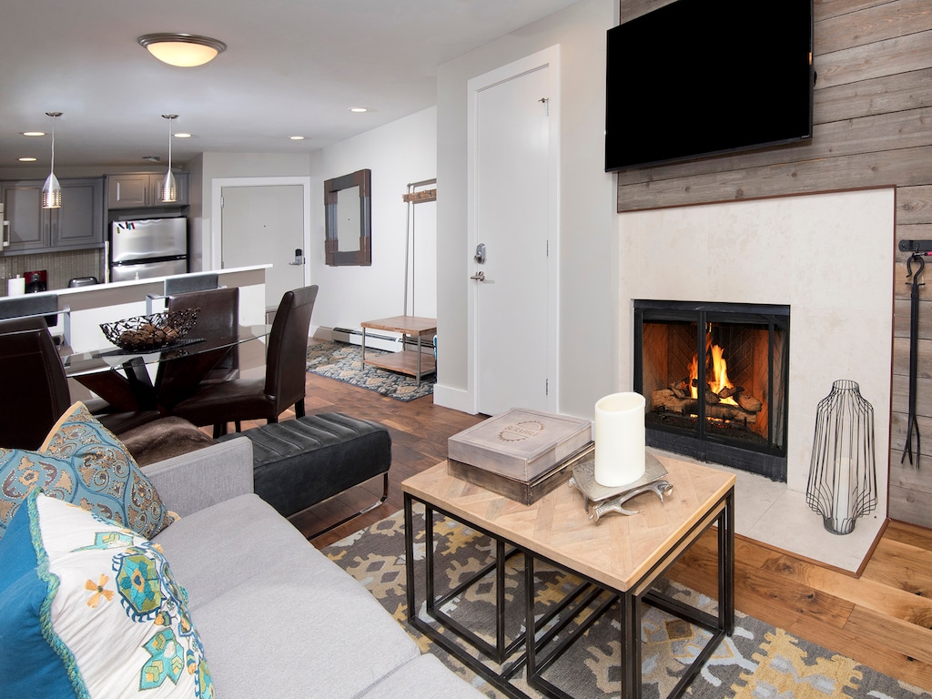 Living Room w/ 55 Inch TV & Wood Burning Fireplace