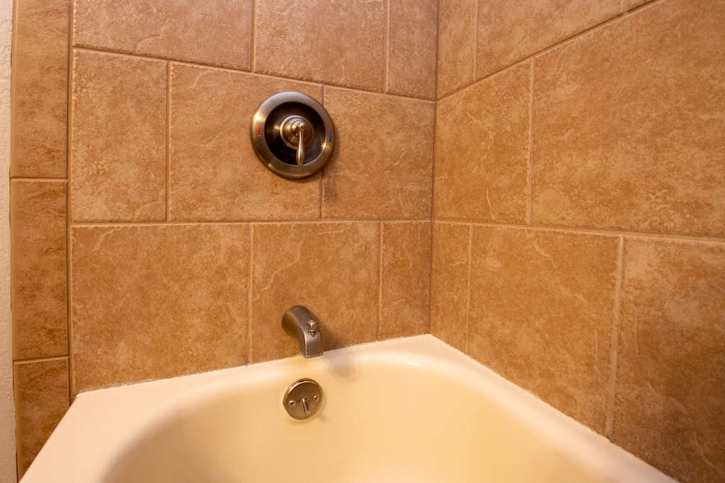 A nice fully tiled bath with a shower/tub combo