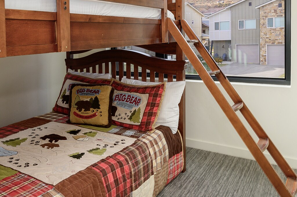 - Fun bunk bed setup with playful mountain-inspired bedding for kids   - Large window brightens the space with scenic outdoor community views   - Perfect cozy retreat for families or groups enjoying mountain stays