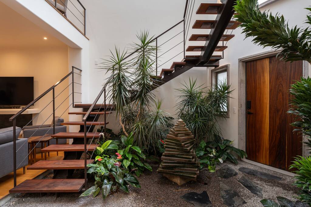 Front door entry with indoor garden and fountain feature