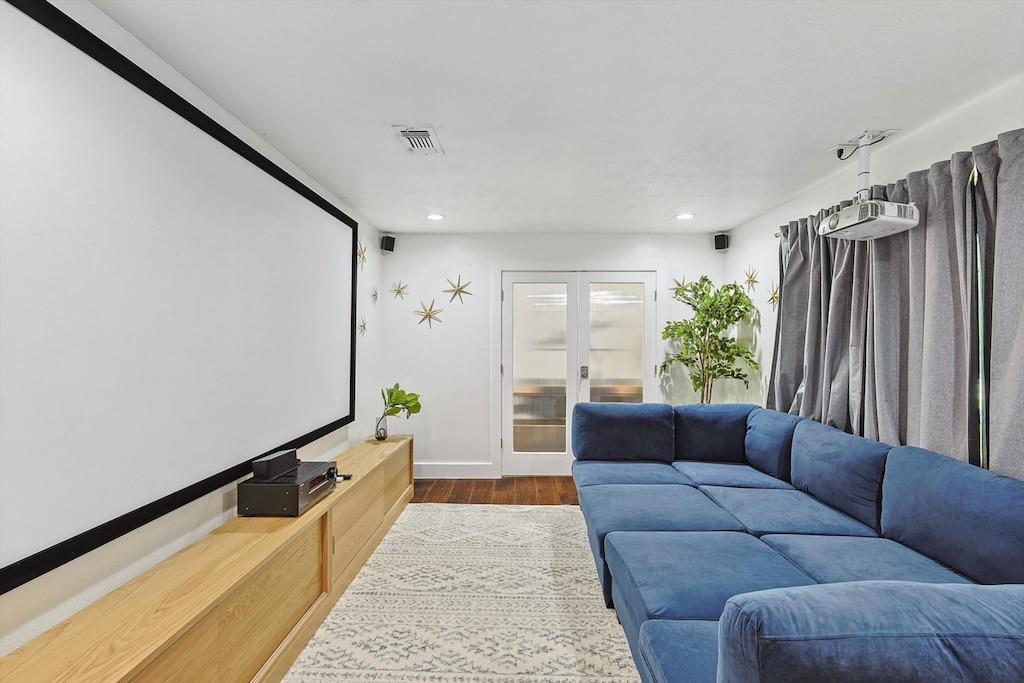Movie nights at home just got a lot more epic in this fully decked-out theatre room with an expansive movie screen and a plush couch you can lay down on.