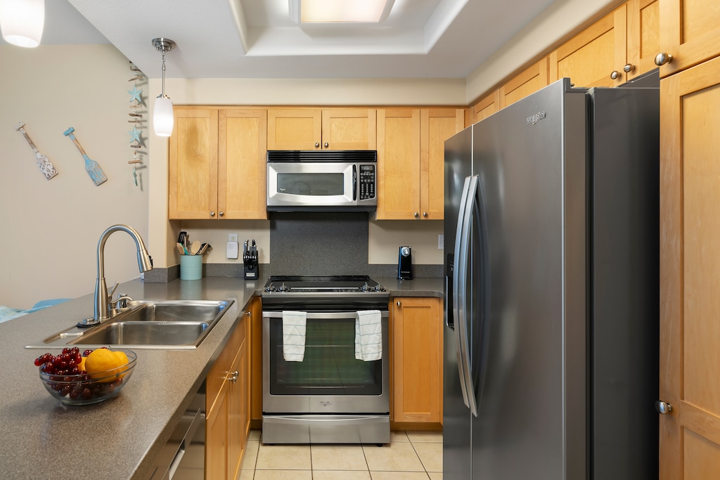 Preparing meals is a breeze in the fully-stocked kitchen with stainless steel appliances and ample counter space.