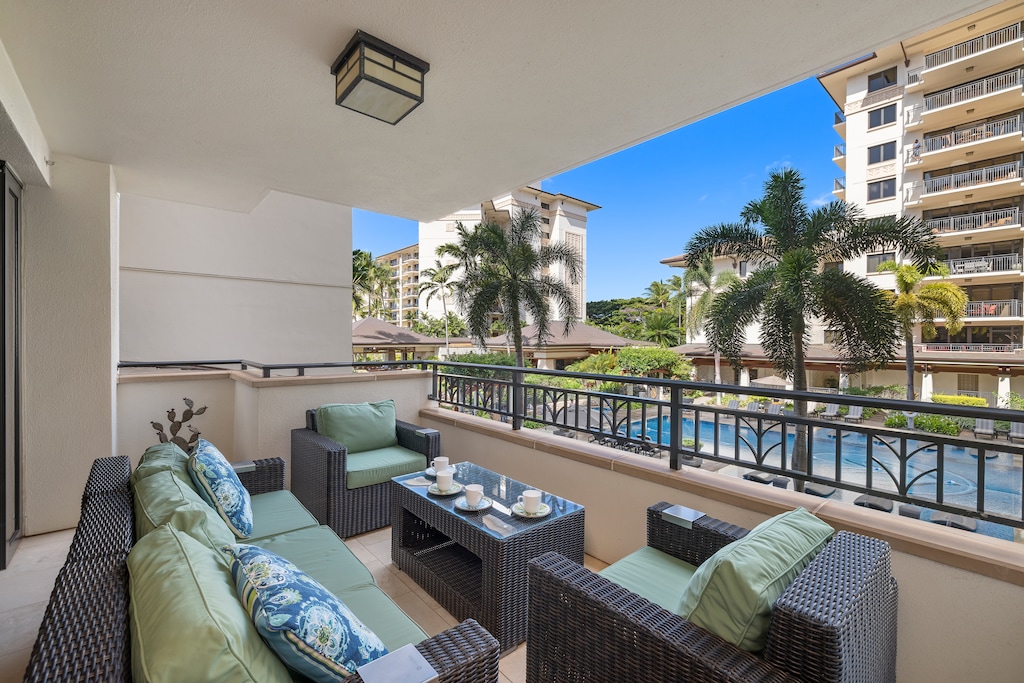 Another incredible view of the lanai surrounded by swaying palm trees.
