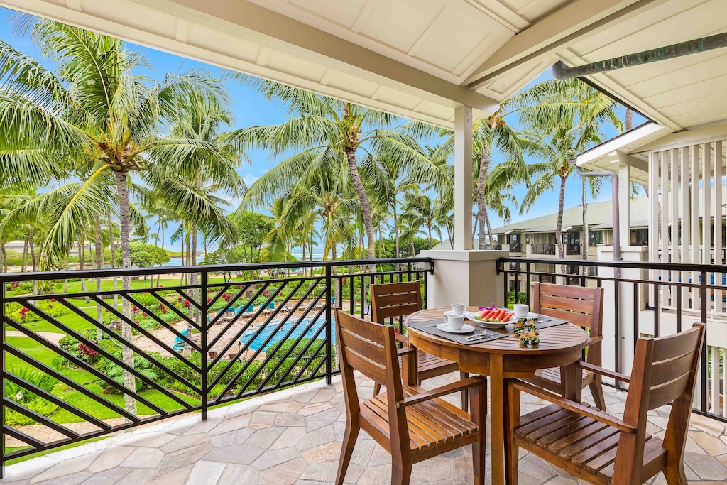 Enjoy breakfast or sunset cocktails on your lanai with views of the pool and lush tropical grounds.