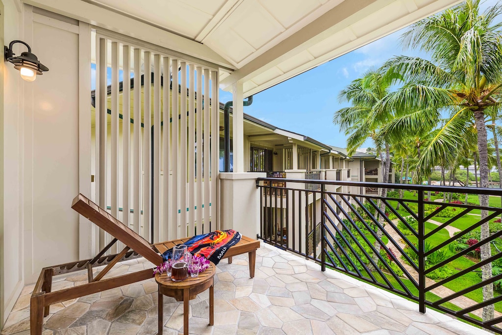 Relax in comfort while overlooking swaying palms and the sparkling Ocean Villas pool.