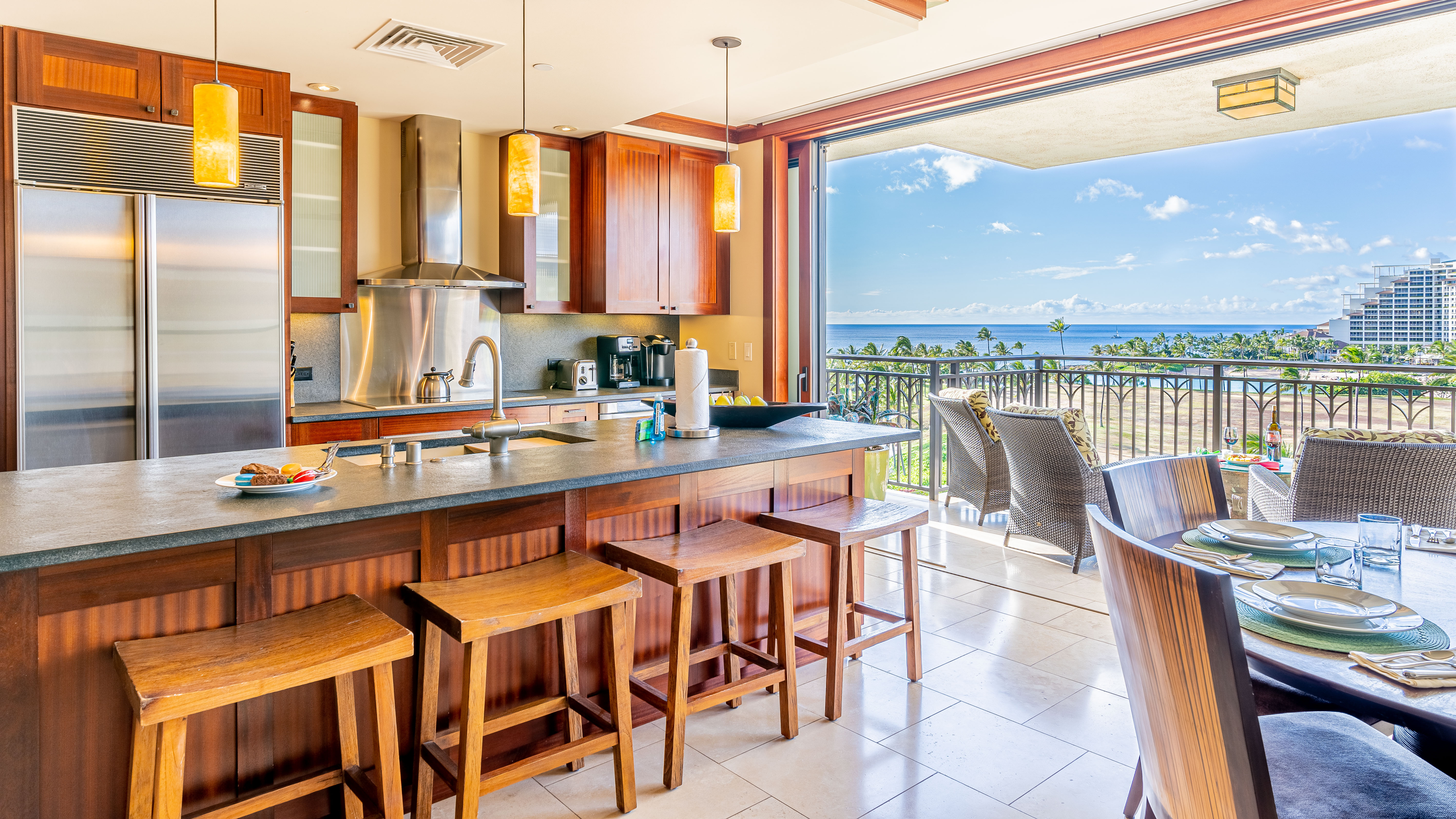 An open dining area with seating for six and soft ocean breezes.