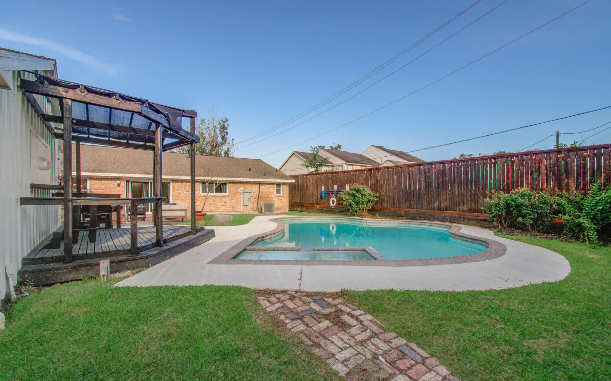 Designed for creating unforgettable memories, this backyard offers so much for adults and children alike to enjoy with the pool, patio, BBQ, and playground!