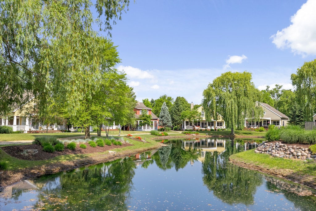 Enjoy the serene pond and beautiful greenery on this tranquil property.