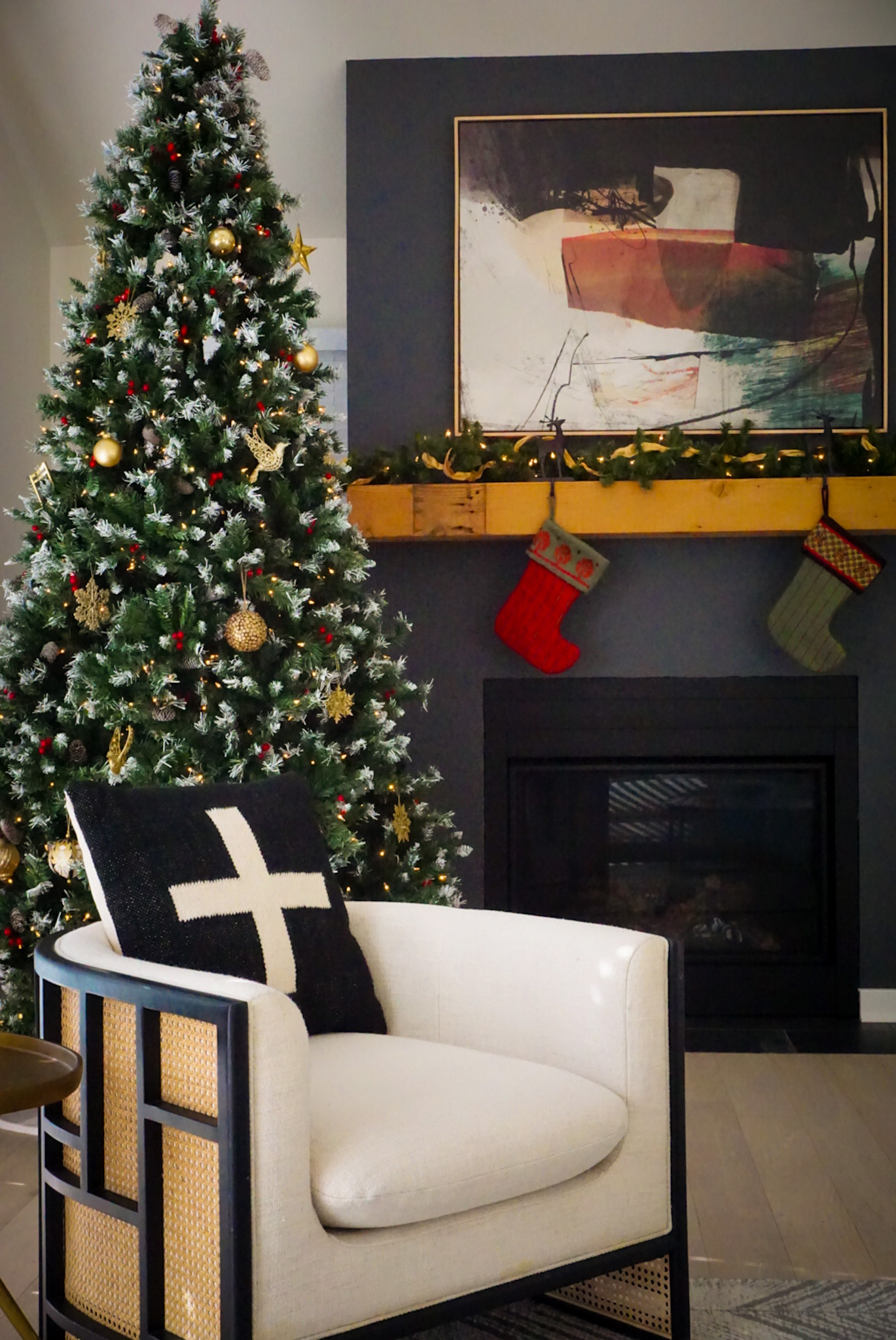 Cozy corner goals: stockings are hung, tree is glowing, and this chair is just waiting for some hot cocoa company.