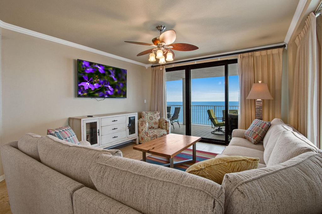 Living room with flat-screen TV and private balcony