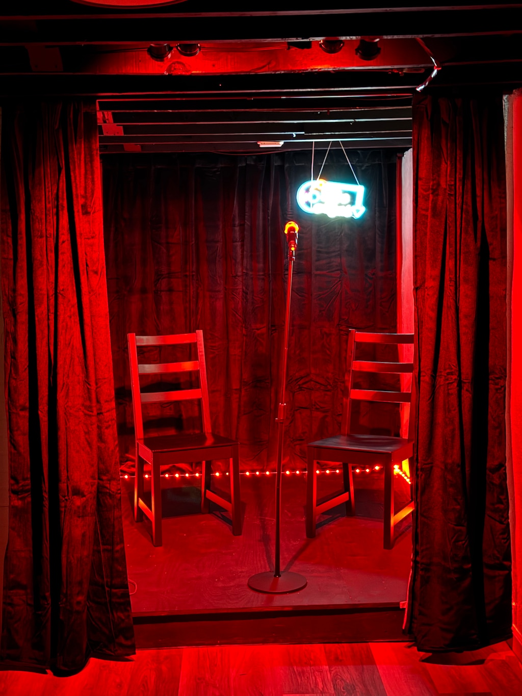 Step into your own infrared sauna sanctuary, where warm red light and wooden benches create the perfect wellness retreat for deep relaxation.