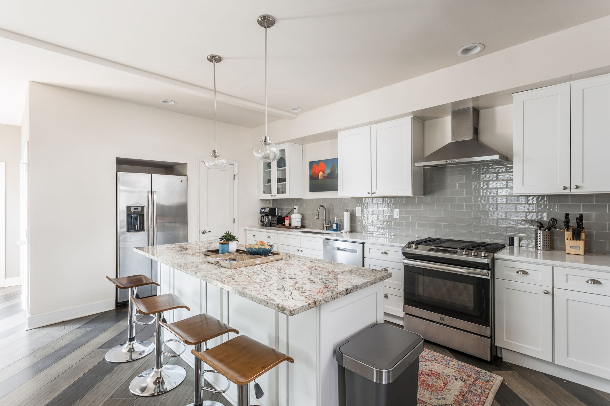 Our kitchen features bar seating, modern appliances, a coffee station, and all the basic essentials needed for your stay!