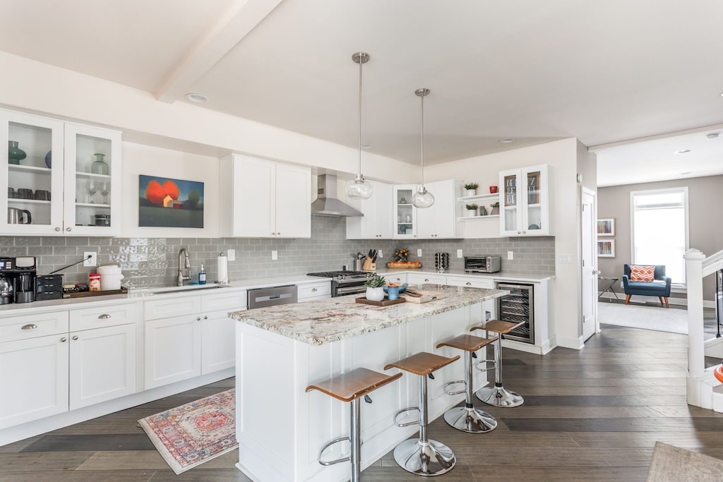 Our kitchen features bar seating, modern appliances, a coffee station, and all the basic essentials needed for your stay!