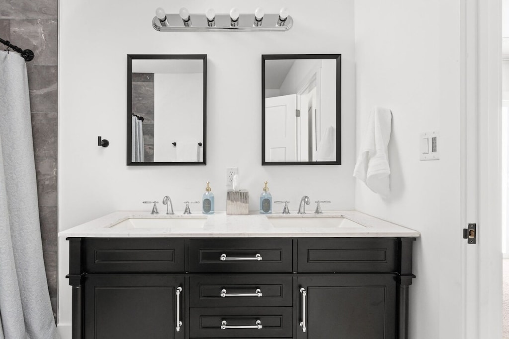 Master Bathroom: Sleek dual vanities and modern mirrors create a stylish retreat for your getaway!