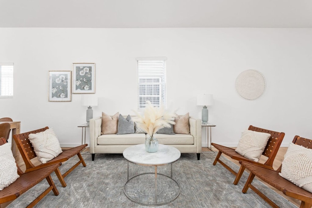 Living Room: Stylish space with modern art and inviting seating for fun gatherings or quiet nights in!