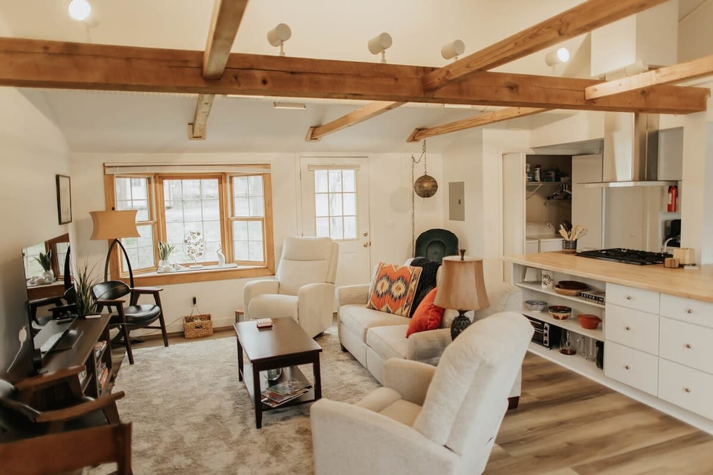 Unwind and luxuriate in the comfort of our inviting living room, where plush sofas and soft pillows beckon you to sink in and let your cares melt away. Designed with your relaxation in mind, our cozy space is the perfect retreat after a long day of adventure or work. Soothe your senses, kick back, and immerse yourself in moments of pure tranquility. It's time to embrace comfort and unwind in style – come, settle in, and let relaxation be your only agenda.