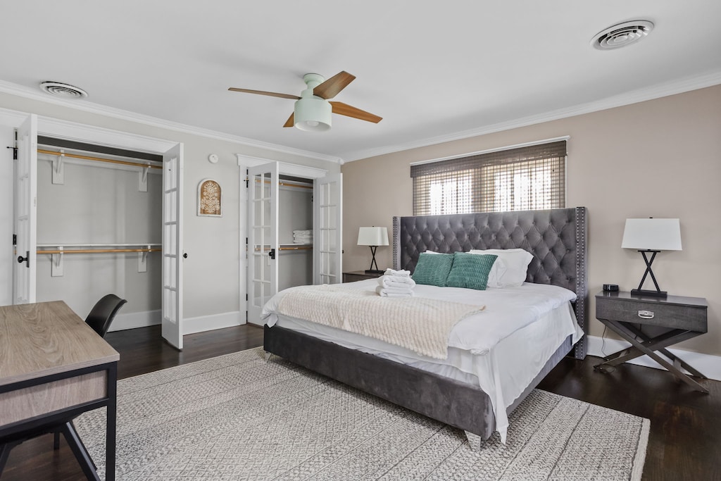 Primary Bedroom: Bright and inviting, featuring luxe furnishings and a stylish workspace!