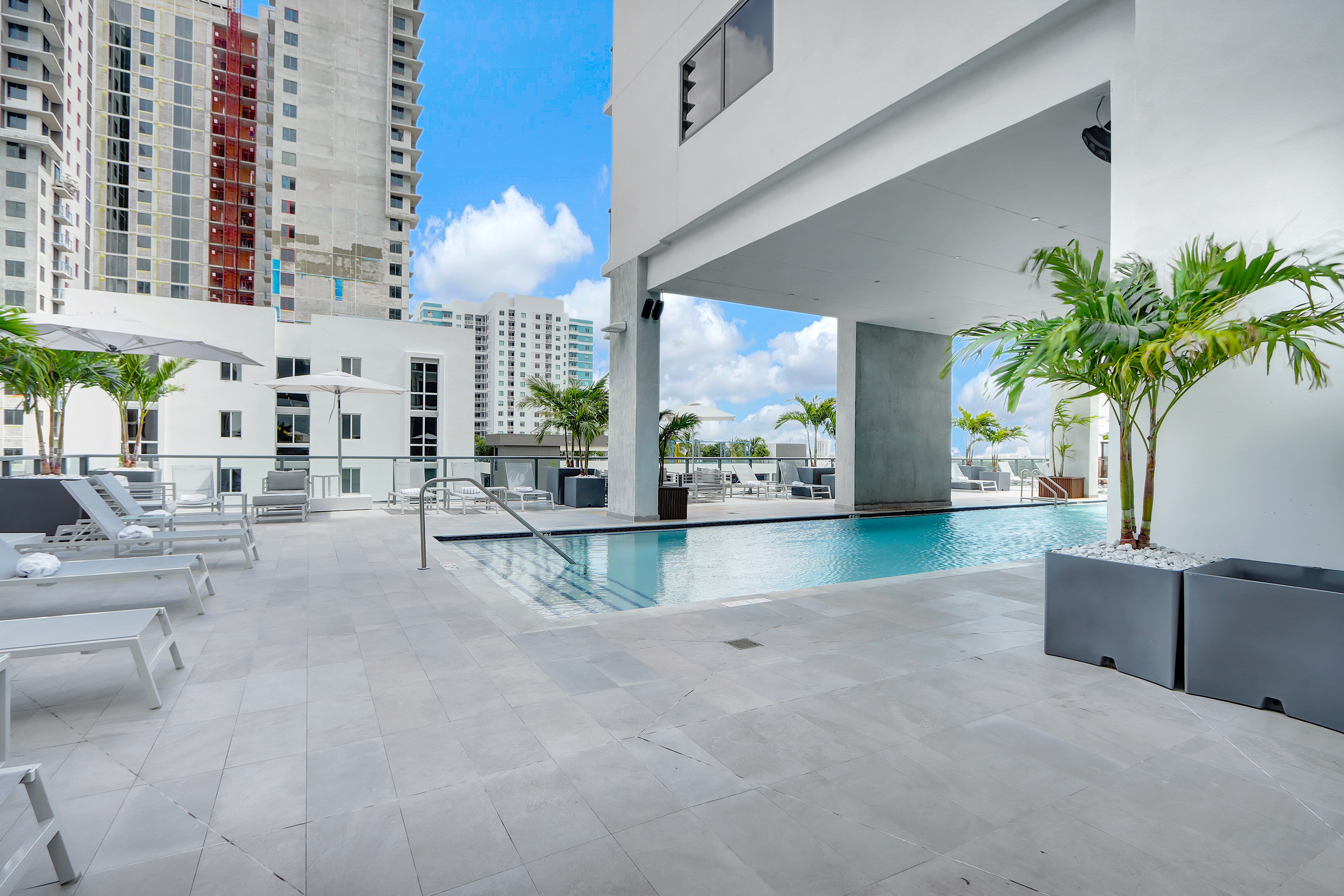 Rooftop Pool Area | Shallow step entry into the larger pool, loungers for sunbathing.