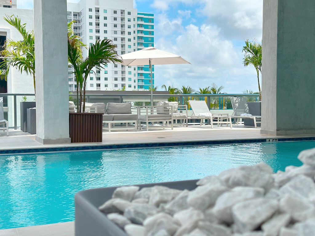 Rooftop Pool Area | Features two heated pools + lounge.