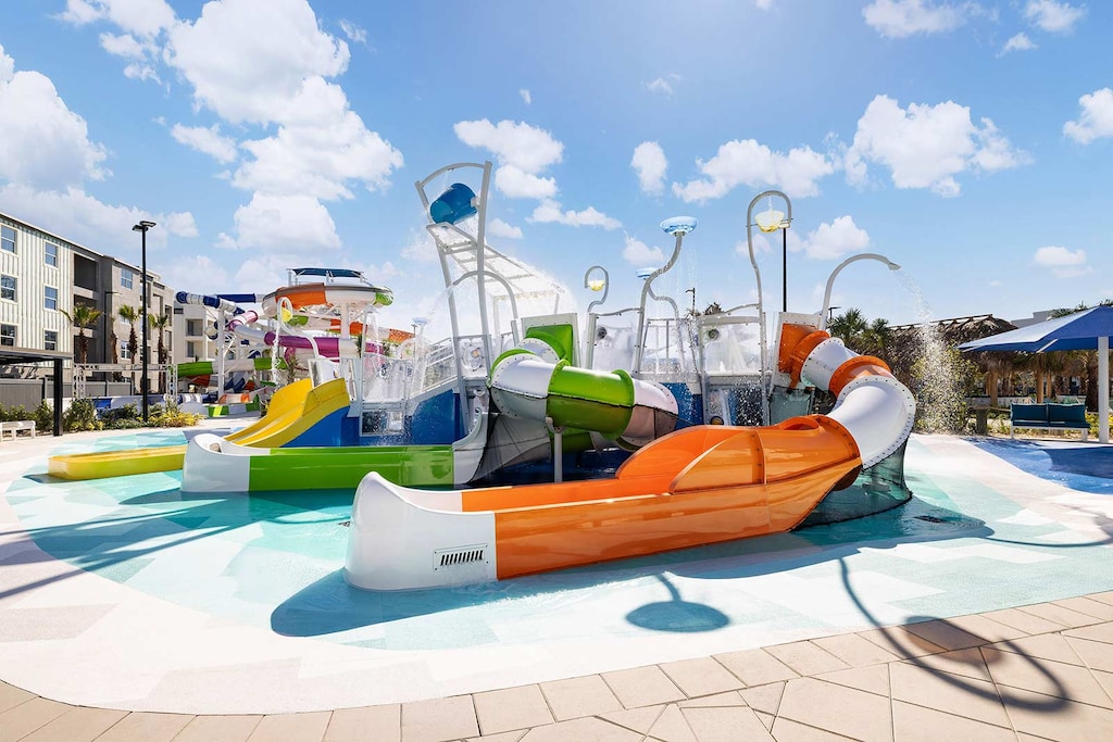 Enjoy a sun-soaked adventure at the Splash Cove Wet Playground at Aqua Bay