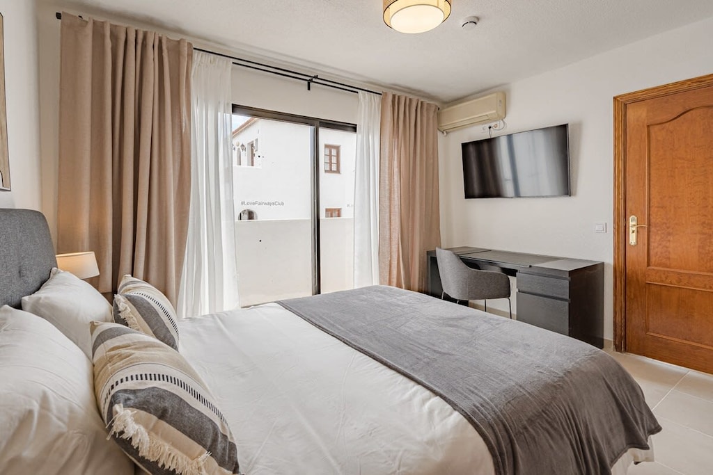 Master Bedroom with Queen-size Bed, TV, Wardrobe, Desk & AC