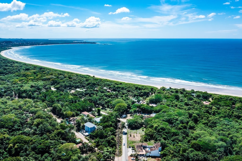 Playa Grande: Escape to serenity where vibrant green embraces the azure sea.

