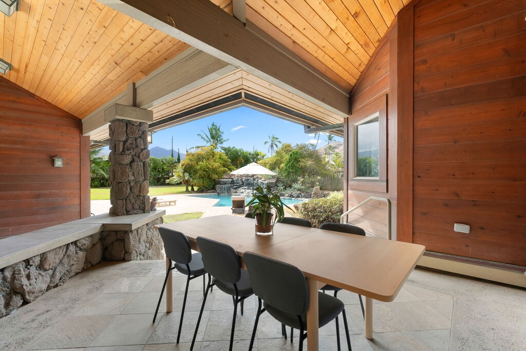 Covered outdoor dining with gentle ocean breezes and lush garden views.