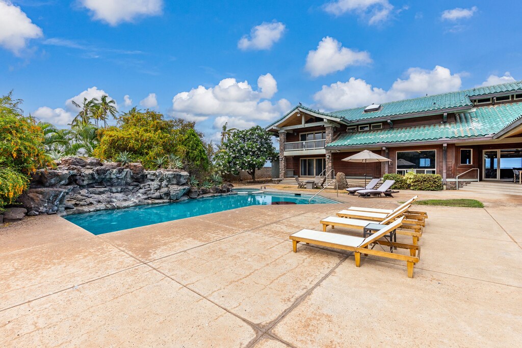 Spacious pool deck perfect for lounging under the Hawaiian sun.