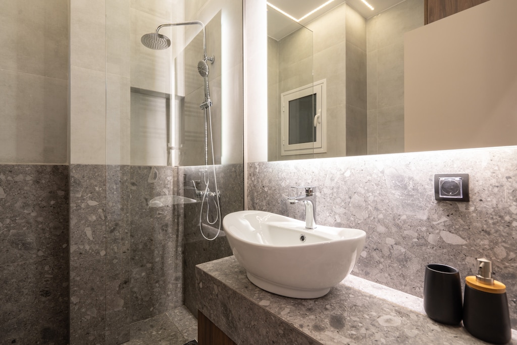 Rejuvenate in your stylish bathroom, featuring a refreshing rain shower to invigorate your senses.