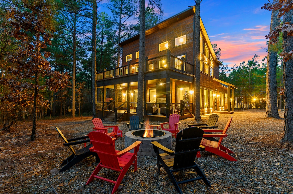 Firepit, back patio and back deck nestled amongst the trees
