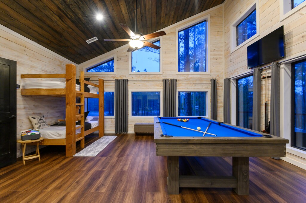 Have a treehouse moment in the upstairs bunkroom adorned by windows