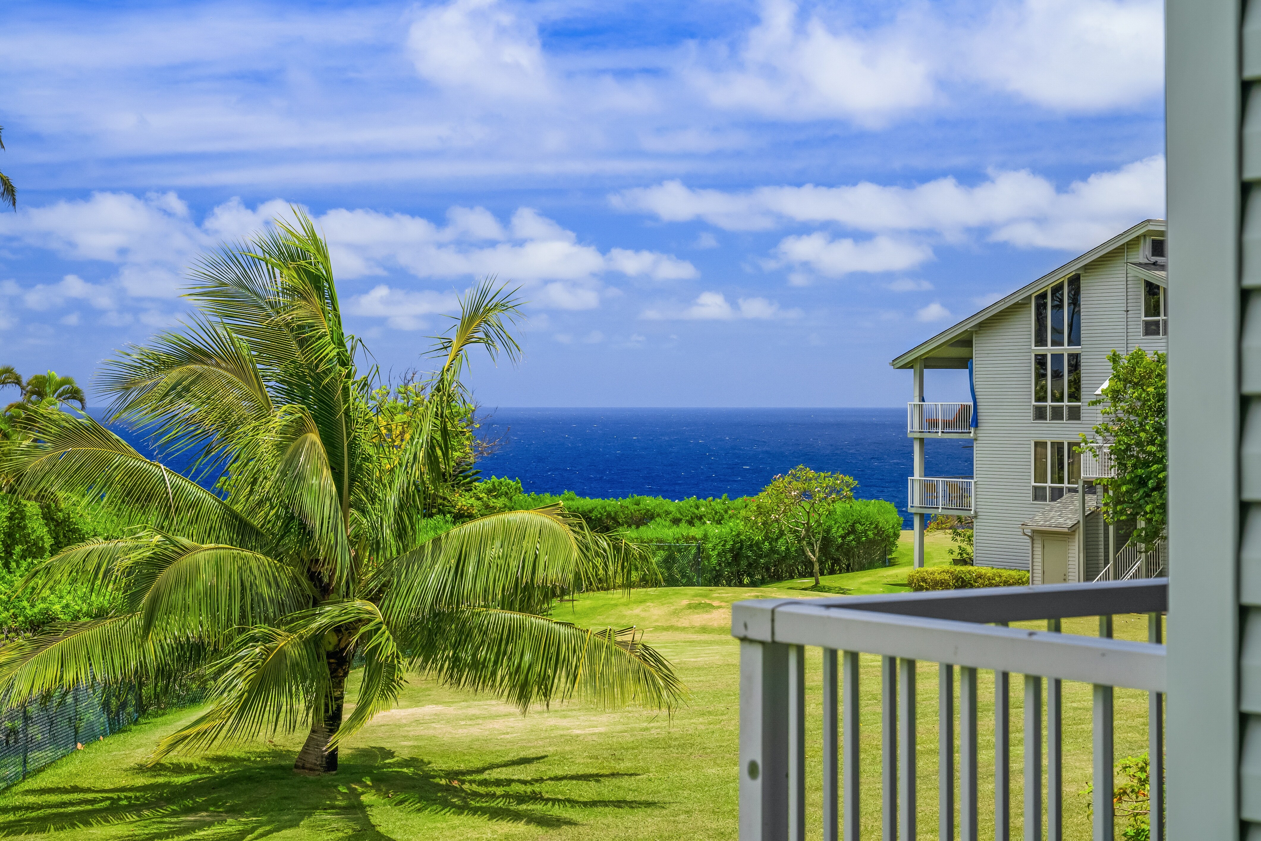 Step onto your private second-floor patio and take in the stunning panoramic views of the sparkling blue ocean.