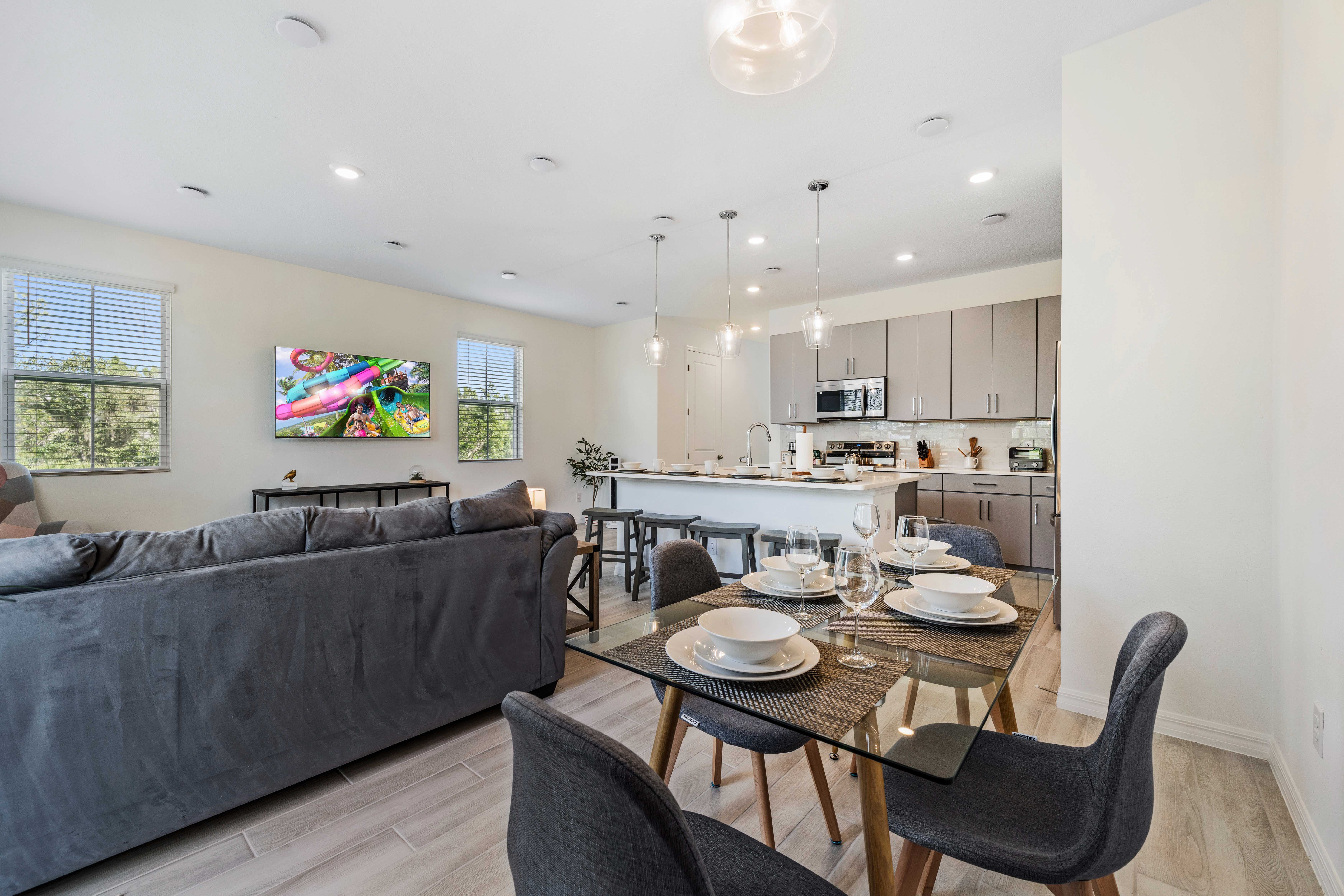 A beautiful townhouse with an open layout that creates a sense of spaciousness - Thoughtfully designed for both relaxation and entertainment, with comfy seating and elegant decor - Kitchen equipped with an island, serves as a perfect gathering spot