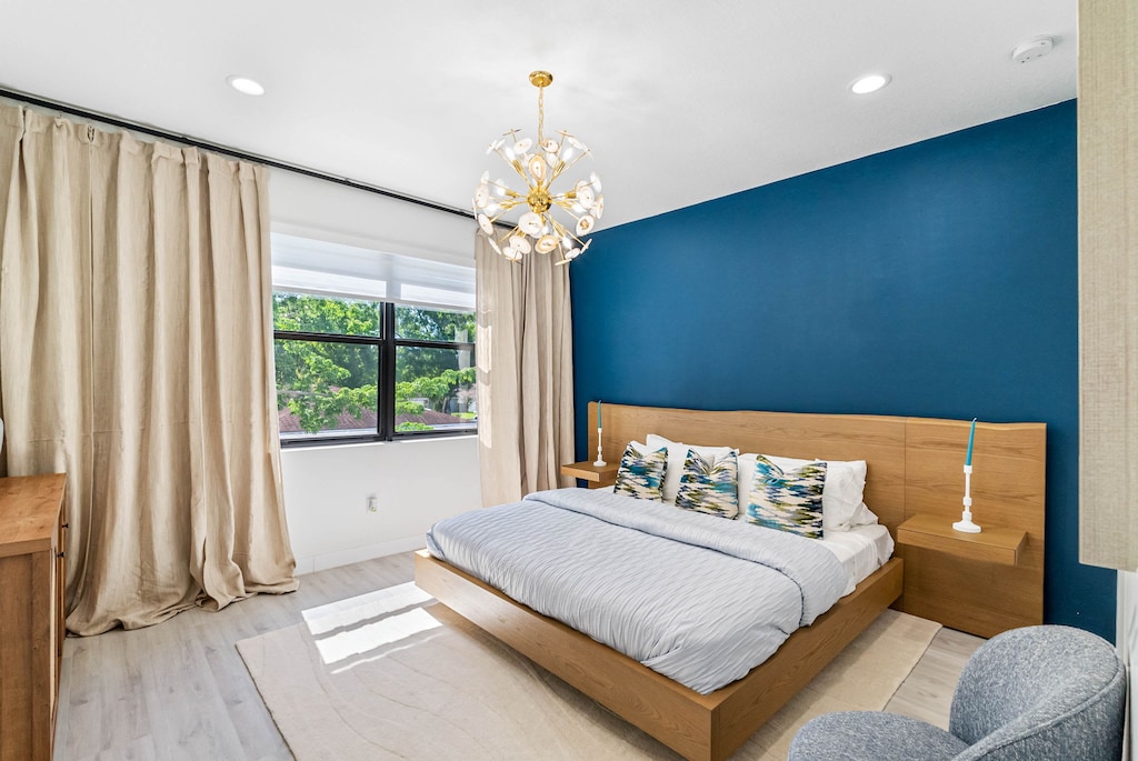 Indulge in luxury with our king-sized bed, illuminated by an elegant hanging light with gold accents, and complemented by built-in nightstands with ready-to-light candles