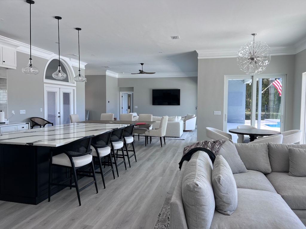 Kitchen meant for entertaining Open area for living room, kitchen opening to expansive back patio with inground pool and hot tub