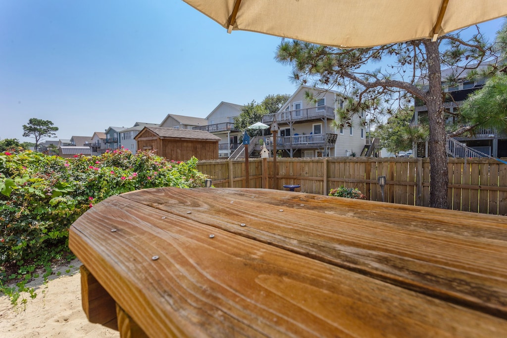 The Outdoor Entertainment Area with a firepit is the ideal spot to soak up the sun and have some fun!