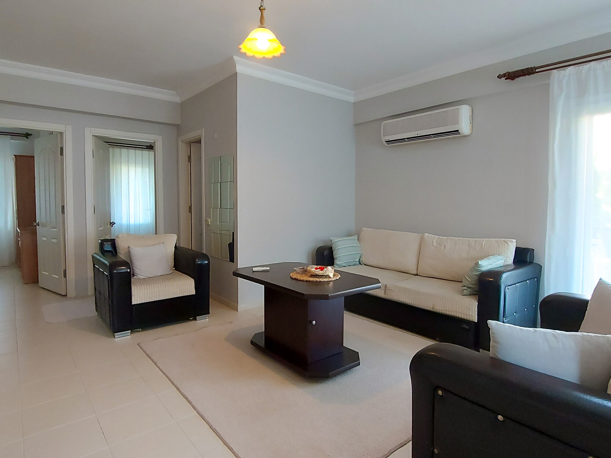 Furnished for comfort and designed for enjoyment, our living room is a haven of relaxation.