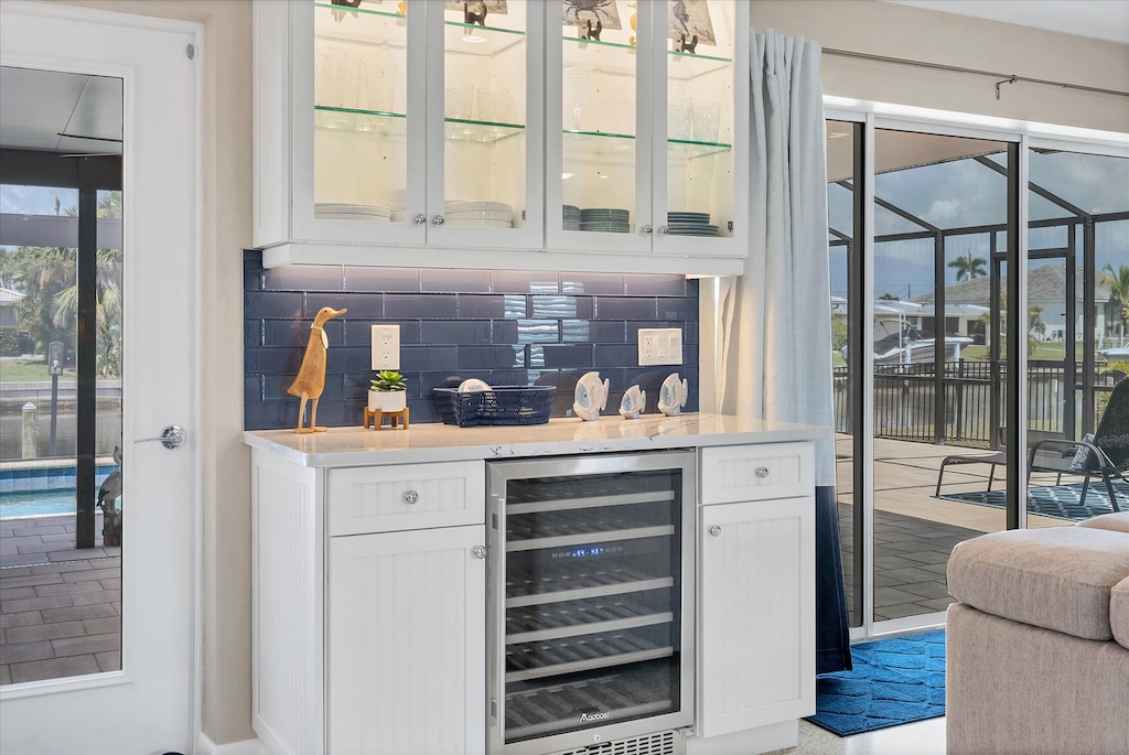 Access to the lanai off the kitchen with wine fridge