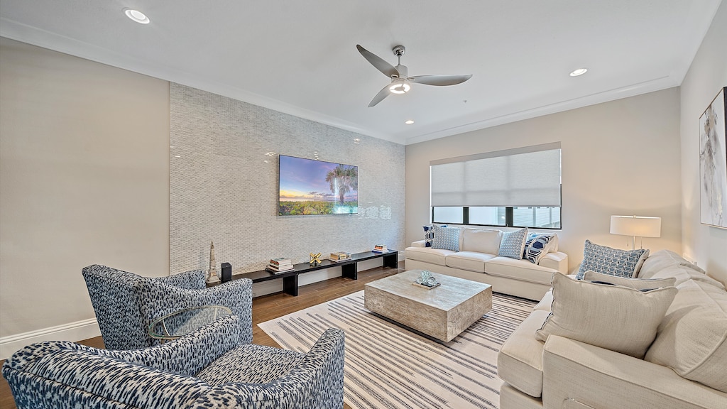 Gather in the bright and inviting living room with coastal-inspired seating, a large Smart TV, and plenty of space to unwind with family and friends.