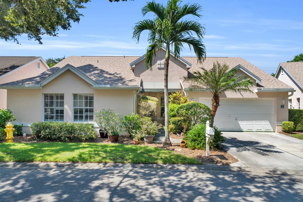 A front view of our home in Lakeside of Naples -please note the garage allows  parking for 1 car