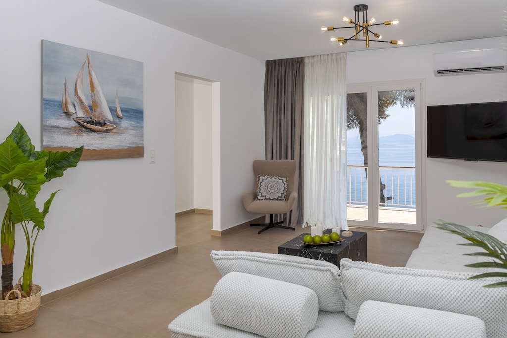 Bright living room with sea-view balcony and modern comforts

