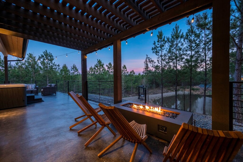 Fire pit table on the back patio with 4 teak chairs