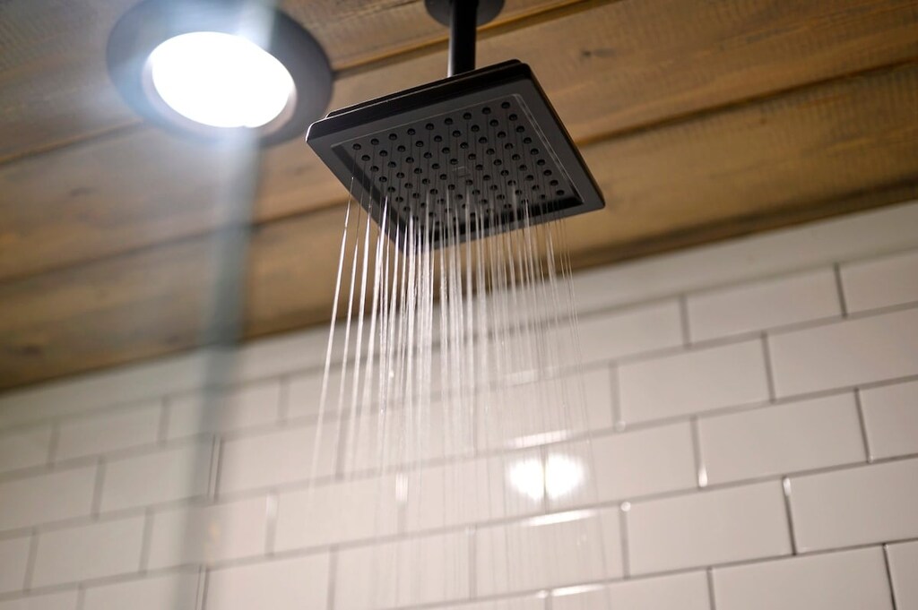 Full ensuite bathroom features a walk-in shower