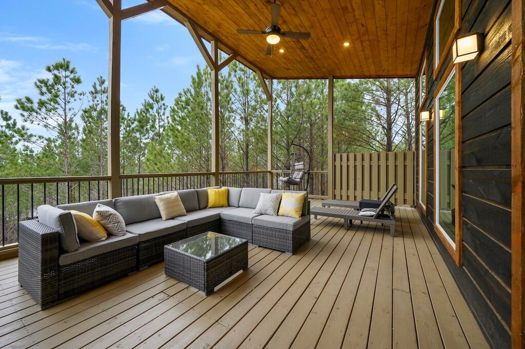 Upper deck has multiple seating areas and a TV