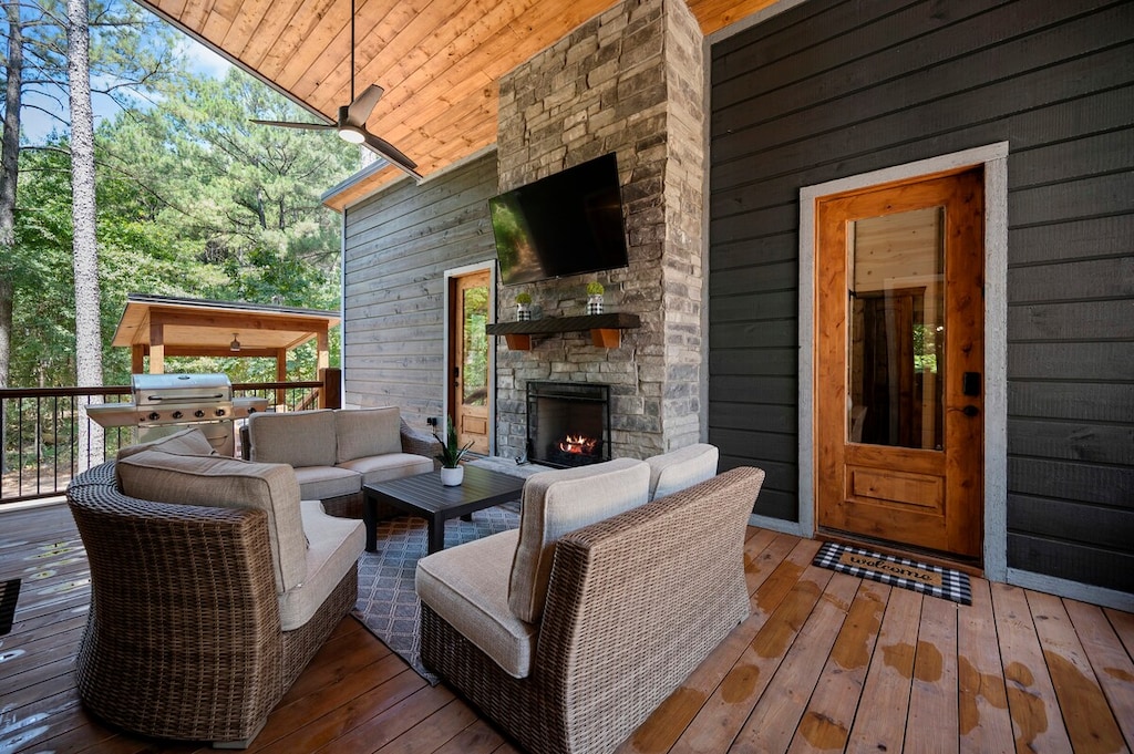 Breezeway with tv and fireplace