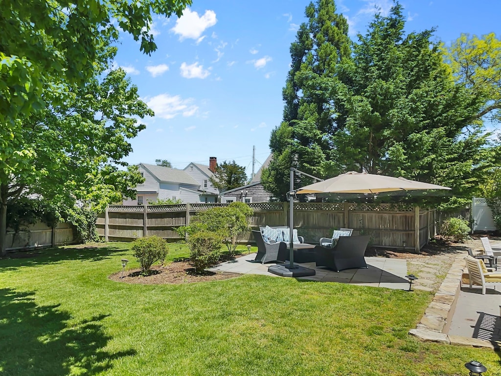 Spacious yard is fully fenced and offers plenty of space to play - 14 Hallett Lane Chatham Cape Cod - Sand Simeon