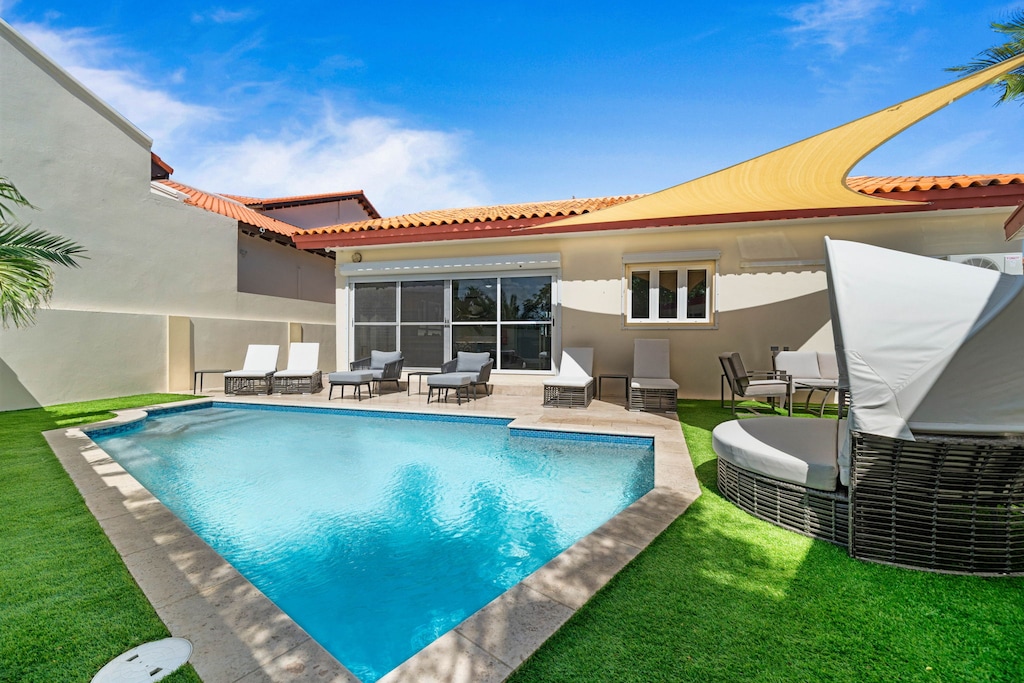 - Stunning private pool area with crystal-clear water, perfect for a refreshing dip - Surrounded by comfortable lounge chairs and a cozy seating area for sunbathing or relaxing - Ideal for enjoying sunny days in a peaceful, secluded outdoor space