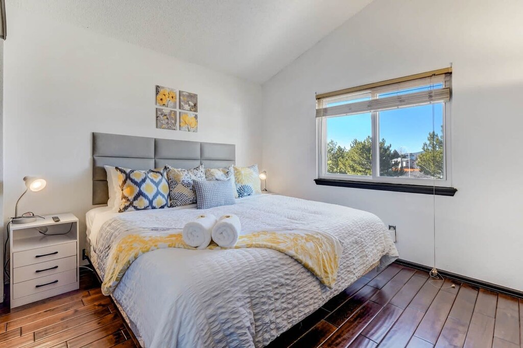 Unwind in the spacious master bedroom featuring a plush king-size bed and serene views—your perfect retreat after a day of adventures.