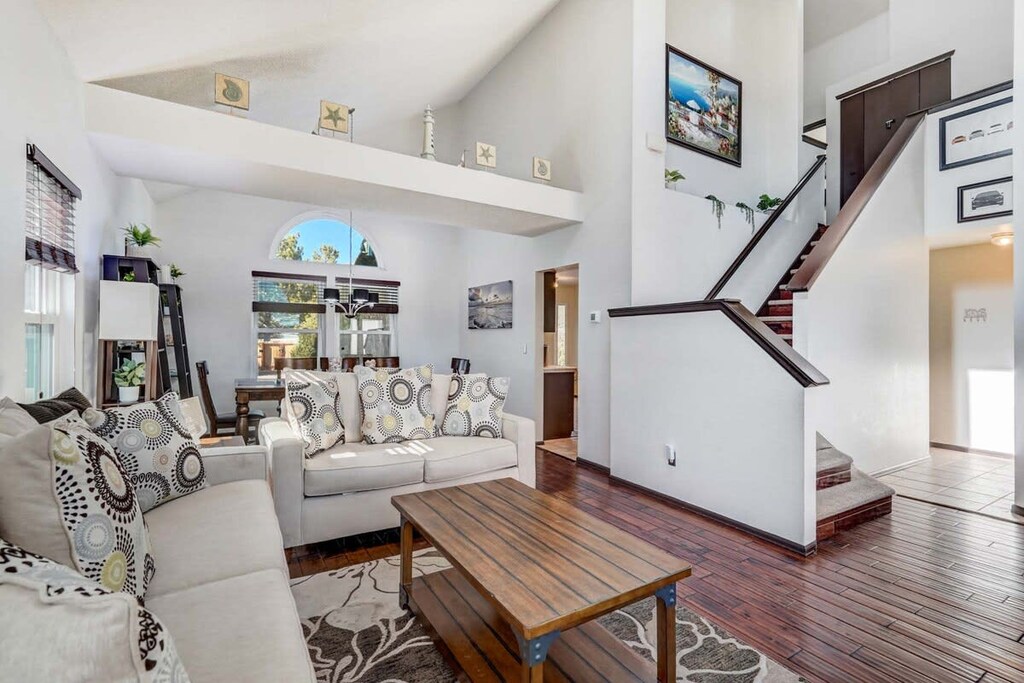 Sunlit living room with cozy seating—perfect for morning coffee or relaxing after a day of exploring Colorado Springs.